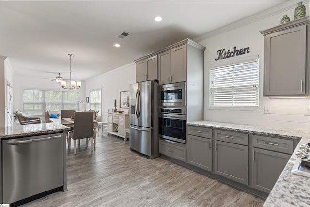 305 Fox Brook Ct, Taylors, SC 29687 - kitchen with visible vents, crown molding, appliances with stainless steel finishes, gray cabinetry, and a notable chandelier