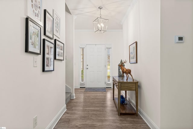 305 Fox Brook Ct, Taylors, SC 29687 - entryway featuring an inviting chandelier, ornamental molding, dark wood-style flooring, baseboards, and stairway