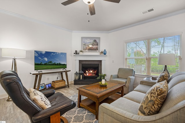 305 Fox Brook Ct, Taylors, SC 29687 - living room with visible vents, crown molding, wood finished floors, a lit fireplace, and a ceiling fan