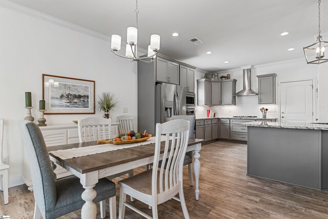 305 Fox Brook Ct, Taylors, SC 29687 - dining space with an inviting chandelier, recessed lighting, crown molding, and light wood-type flooring