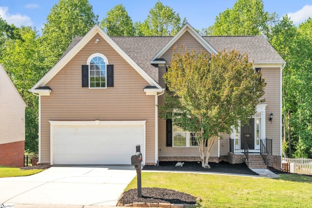 view of front of house with fence, concrete driveway, a front lawn, and a garage