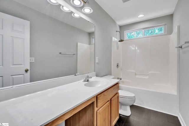 bathroom with shower / bath combination, visible vents, wood finished floors, vanity, and toilet