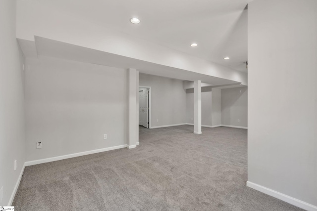 finished below grade area featuring carpet flooring, recessed lighting, and baseboards