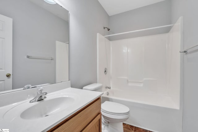 bathroom with vanity, tile patterned flooring, toilet, and tub / shower combination