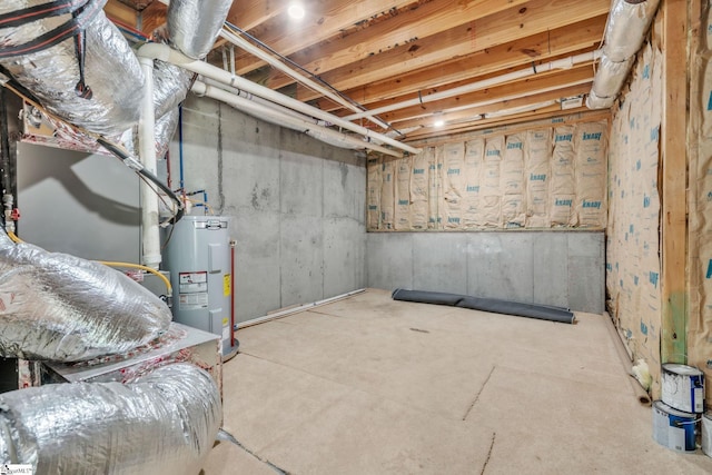 unfinished below grade area featuring electric water heater