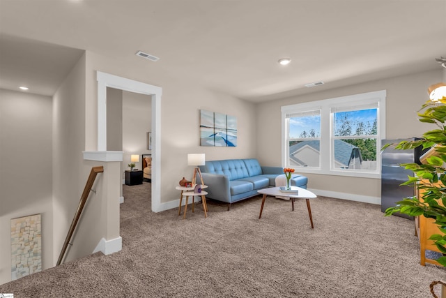 living room featuring visible vents, recessed lighting, carpet, and baseboards