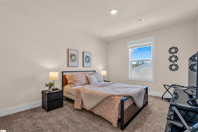 bedroom with carpet flooring, baseboards, and visible vents