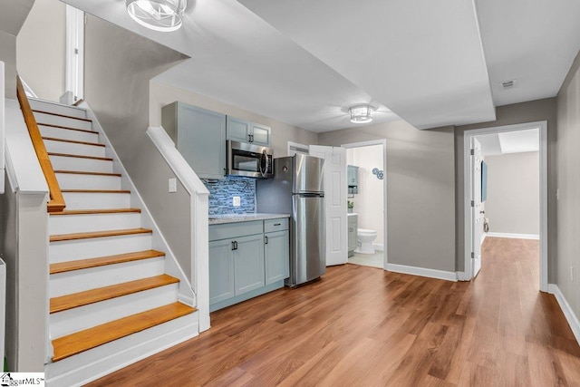 268 Antrim Ave, Moore, SC 29369 - stairway with baseboards, visible vents, and wood finished floors