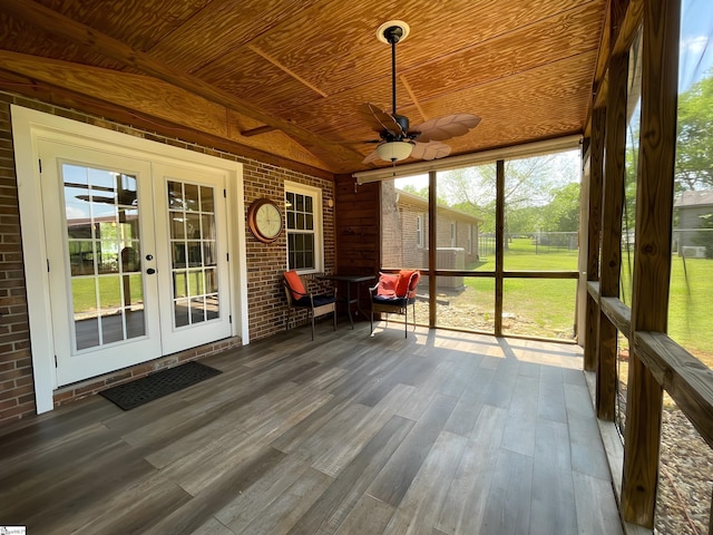 sunroom featuring french doors and a ceiling fan