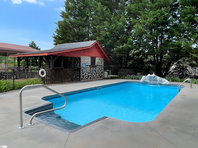 view of swimming pool featuring a fenced in pool, a patio area, and fence