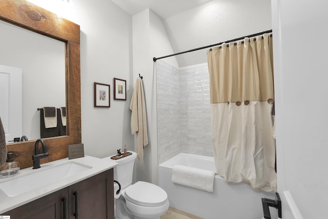 full bath with vanity, shower / bath combo, and toilet