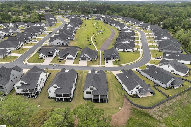 birds eye view of property with a residential view