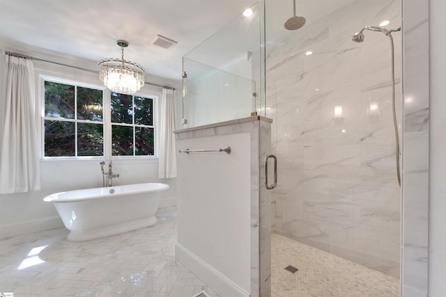 full bathroom with visible vents, baseboards, a chandelier, a marble finish shower, and a soaking tub