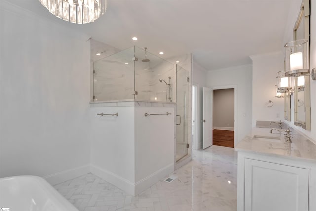 bathroom featuring an inviting chandelier, crown molding, recessed lighting, a soaking tub, and a shower stall