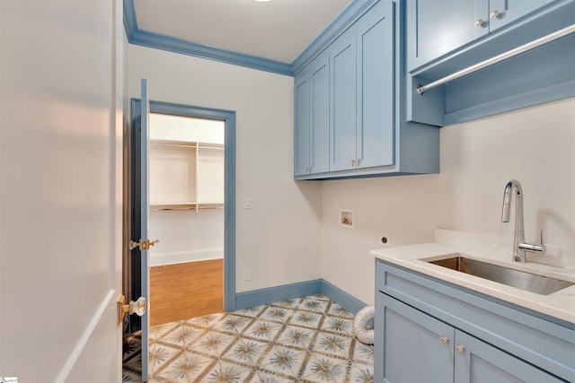 clothes washing area with electric dryer hookup, cabinet space, a sink, hookup for a washing machine, and light floors
