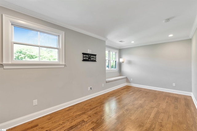 unfurnished room with recessed lighting, baseboards, ornamental molding, and wood finished floors