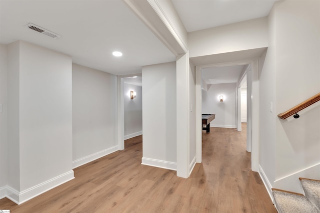 corridor with visible vents, stairs, light wood-style floors, baseboards, and recessed lighting