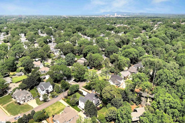 drone / aerial view with a residential view and a forest view