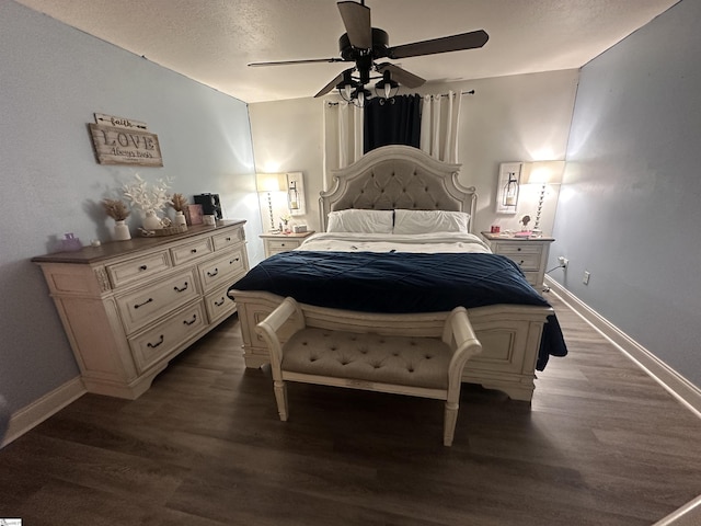 bedroom featuring baseboards, a ceiling fan, and wood finished floors