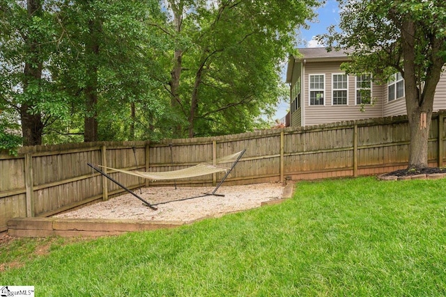 view of yard with a fenced backyard