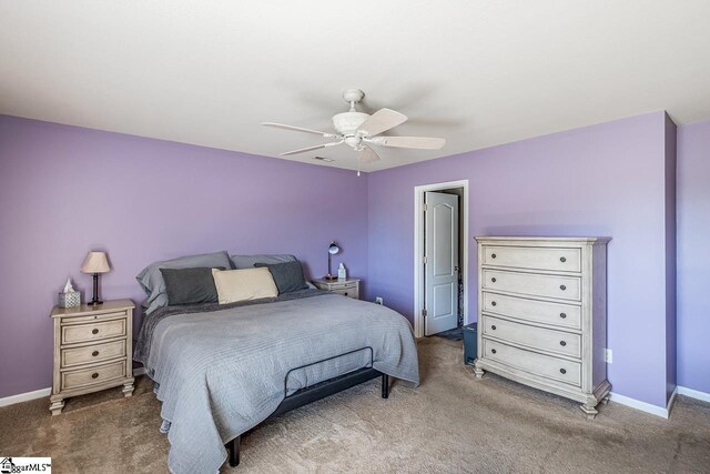 bedroom featuring baseboards, carpet flooring, and ceiling fan