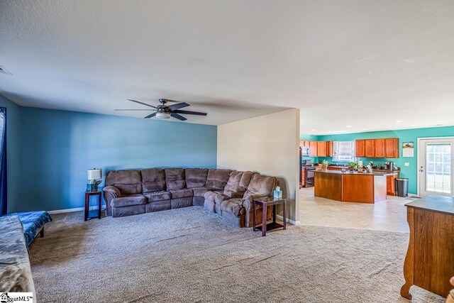 living room with visible vents, recessed lighting, ceiling fan, and light carpet