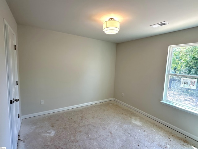 317 W Hampton St, Anderson, SC 29624 - empty room featuring baseboards, concrete floors, and visible vents