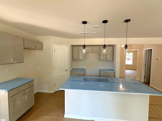 317 W Hampton St, Anderson, SC 29624 - kitchen featuring baseboards, visible vents, hanging light fixtures, and a center island
