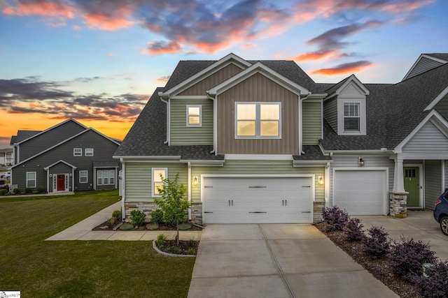 view of front facade featuring board and batten siding, an attached garage, driveway, and stone siding