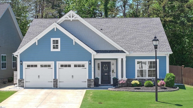 429 Rubia Dr, Greenville, SC 29607 - craftsman-style house with a shingled roof, a front lawn, fence, and driveway