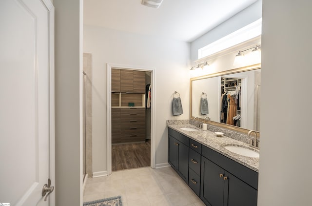 429 Rubia Dr, Greenville, SC 29607 - full bathroom featuring double vanity, a sink, tile patterned floors, and a spacious closet