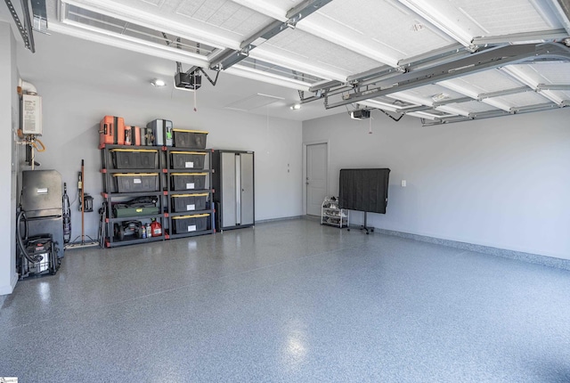 429 Rubia Dr, Greenville, SC 29607 - garage with baseboards and a garage door opener