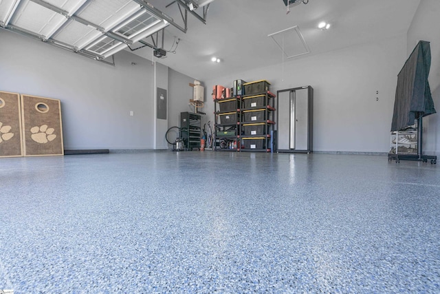 429 Rubia Dr, Greenville, SC 29607 - garage featuring baseboards, a garage door opener, and electric panel