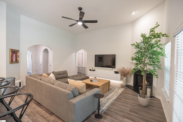 429 Rubia Dr, Greenville, SC 29607 - living area with a ceiling fan, a fireplace with flush hearth, arched walkways, wood finished floors, and baseboards
