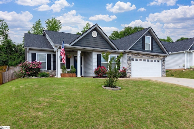 craftsman-style home featuring concrete driveway, fence, roof with shingles, and a front lawn