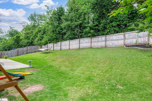 view of yard with a fenced backyard