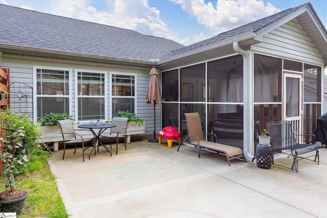 view of patio / terrace featuring a sunroom