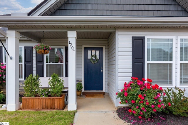 doorway to property with a porch