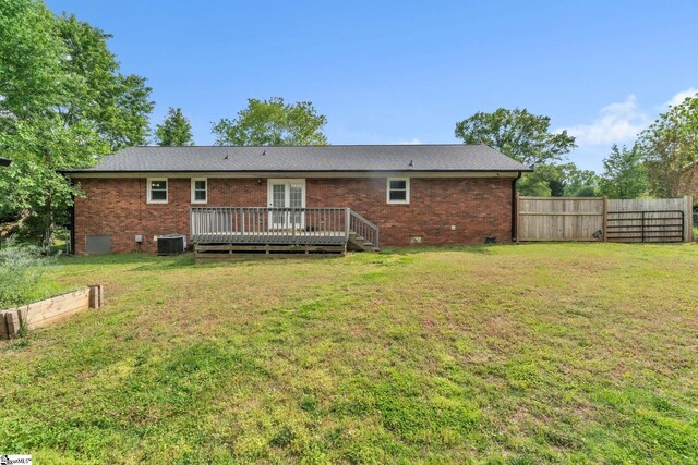 back of house with crawl space, a wooden deck, brick siding, cooling unit, and fence