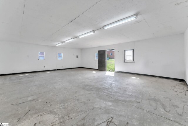 unfurnished room featuring concrete flooring