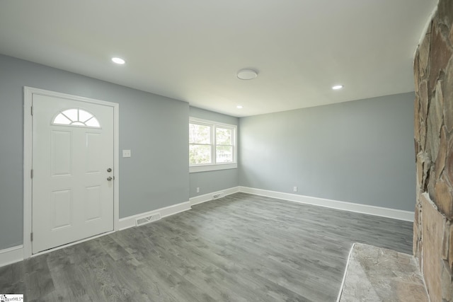 foyer with recessed lighting, baseboards, visible vents, and wood finished floors