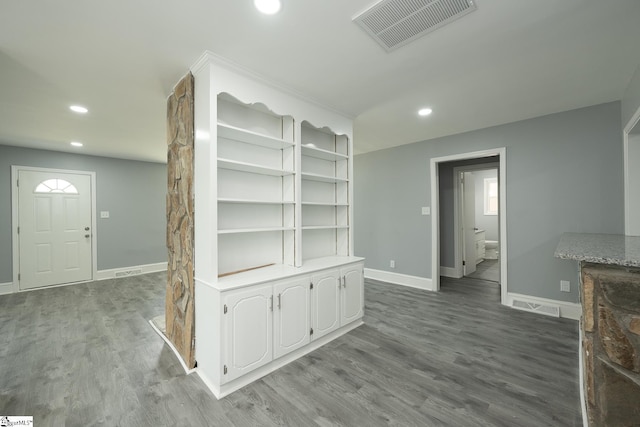 interior space with baseboards, recessed lighting, and visible vents