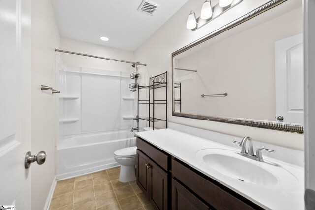 full bath with visible vents, vanity, baseboards, toilet, and washtub / shower combination