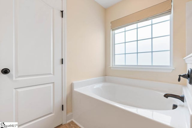 full bathroom with a garden tub