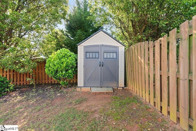 view of shed featuring a fenced backyard