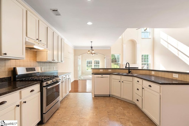 kitchen featuring visible vents, dishwasher, gas stove, a sink, and under cabinet range hood