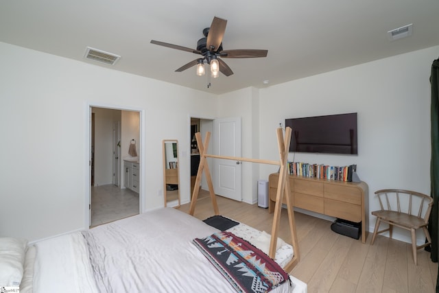 bedroom featuring connected bathroom, ceiling fan, visible vents, and light wood finished floors