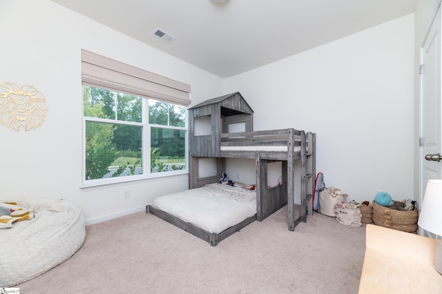 bedroom featuring visible vents, baseboards, and carpet floors