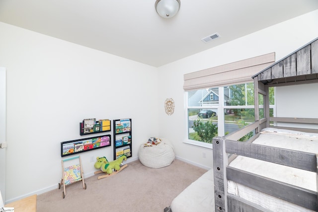 playroom with baseboards, visible vents, and carpet