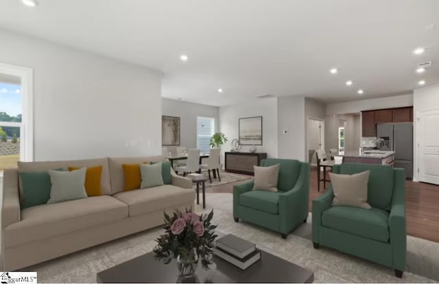 living room with recessed lighting and light wood-type flooring
